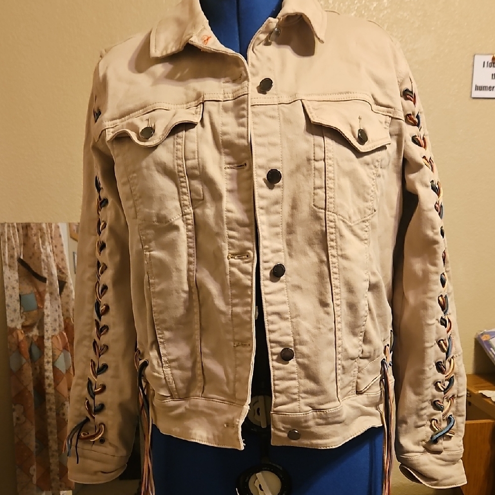 Beige jacket with lace up sleeves and back